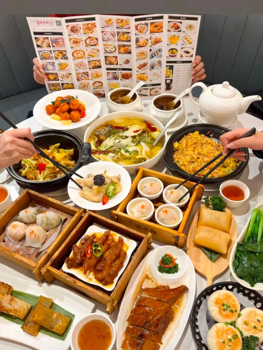 Cantonese morning tea table with dim sum baskets and tea pot