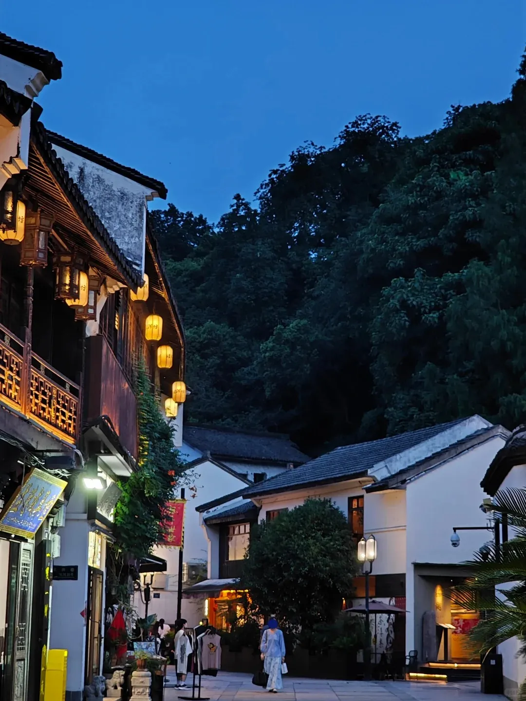 Traditional shopfronts and evening lights along Hangzhou Hefang Street