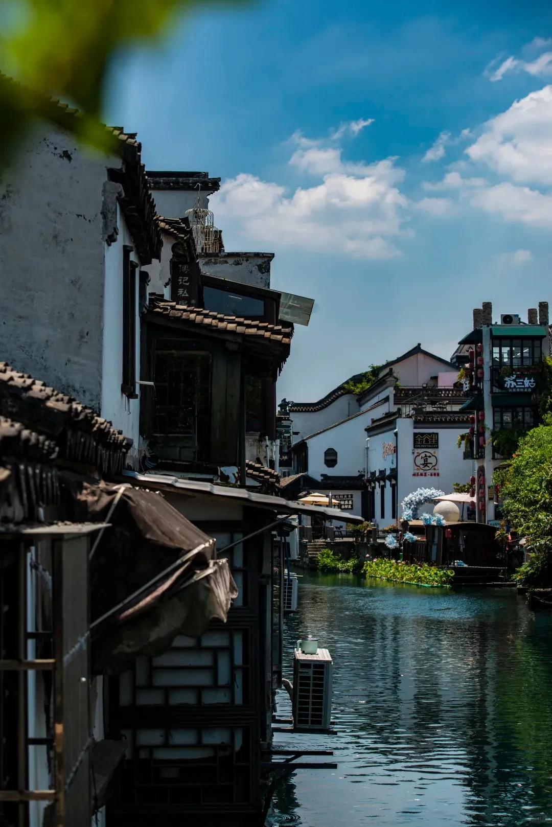 A teahouse window overlooking the canal on Pingjiang Road