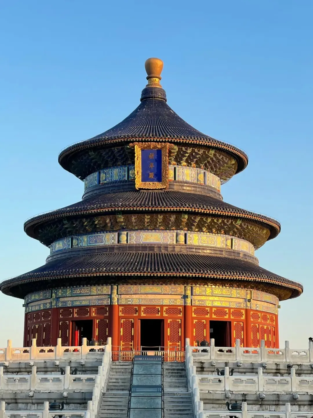 A quiet corner with the Temple of Heaven's rooftops against the sky