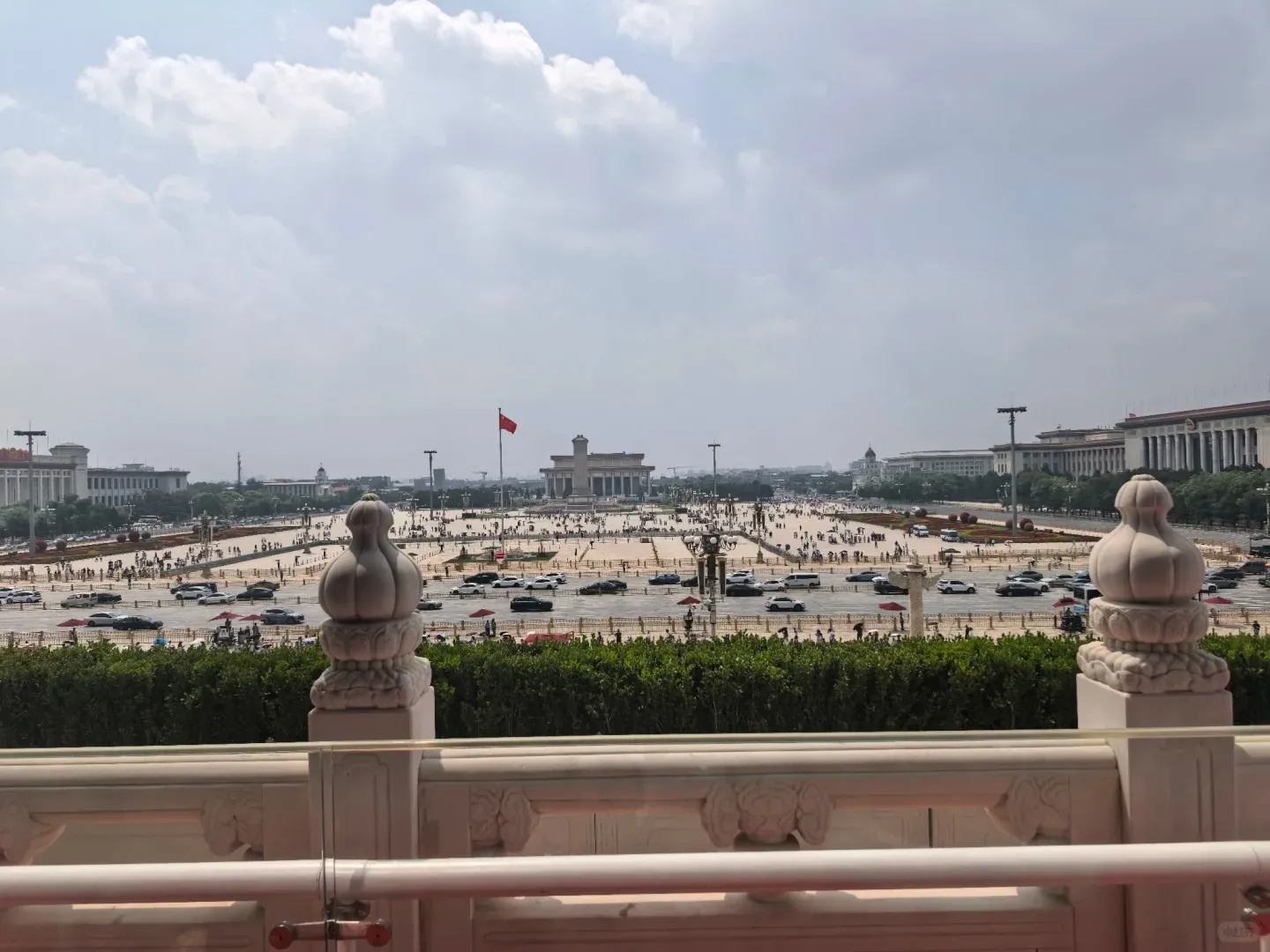 Visitors strolling across the open expanse of Tiananmen Square