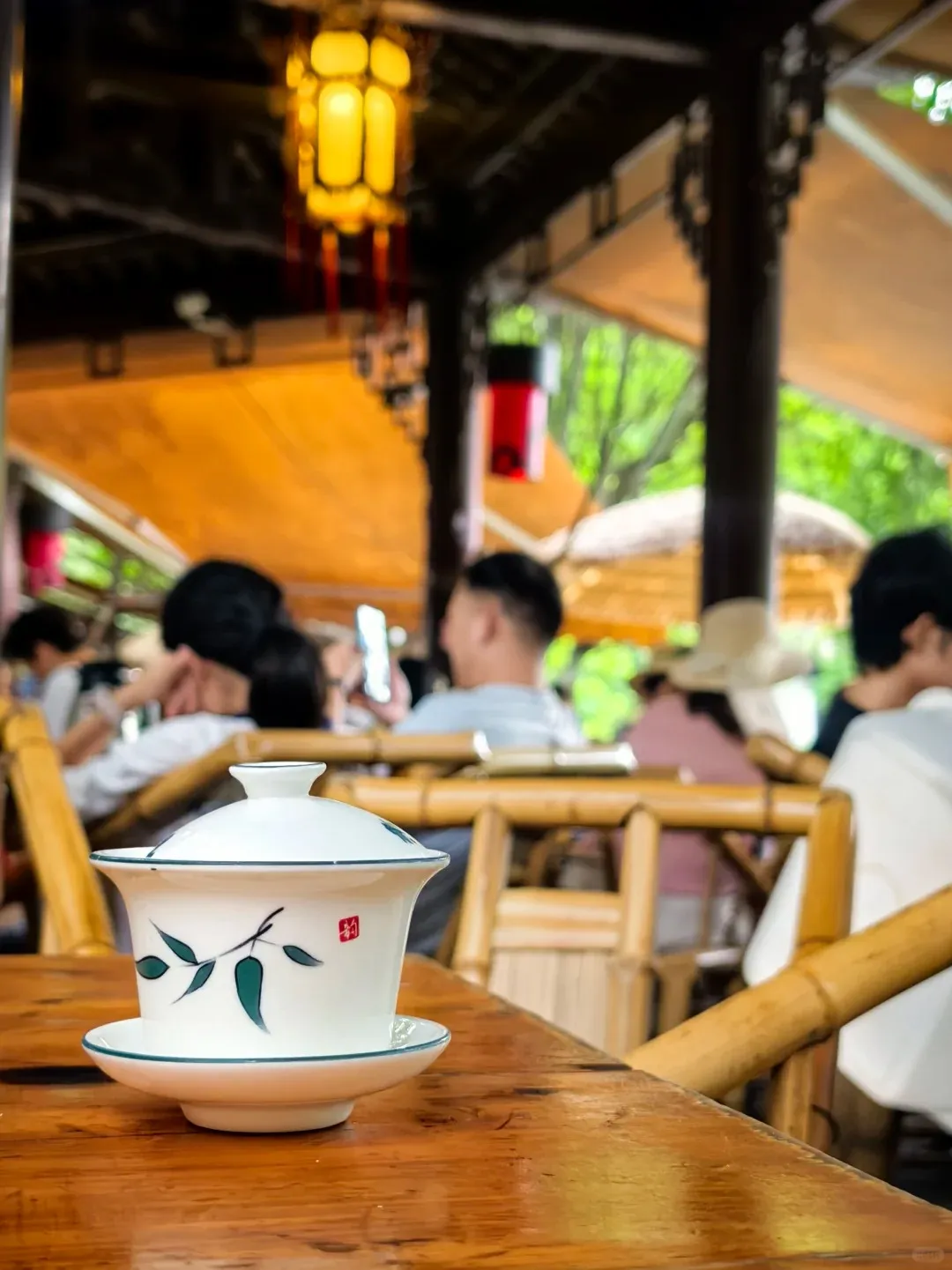 Heming Teahouse, Chengdu — bamboo chairs and gaiwan tea by the lake