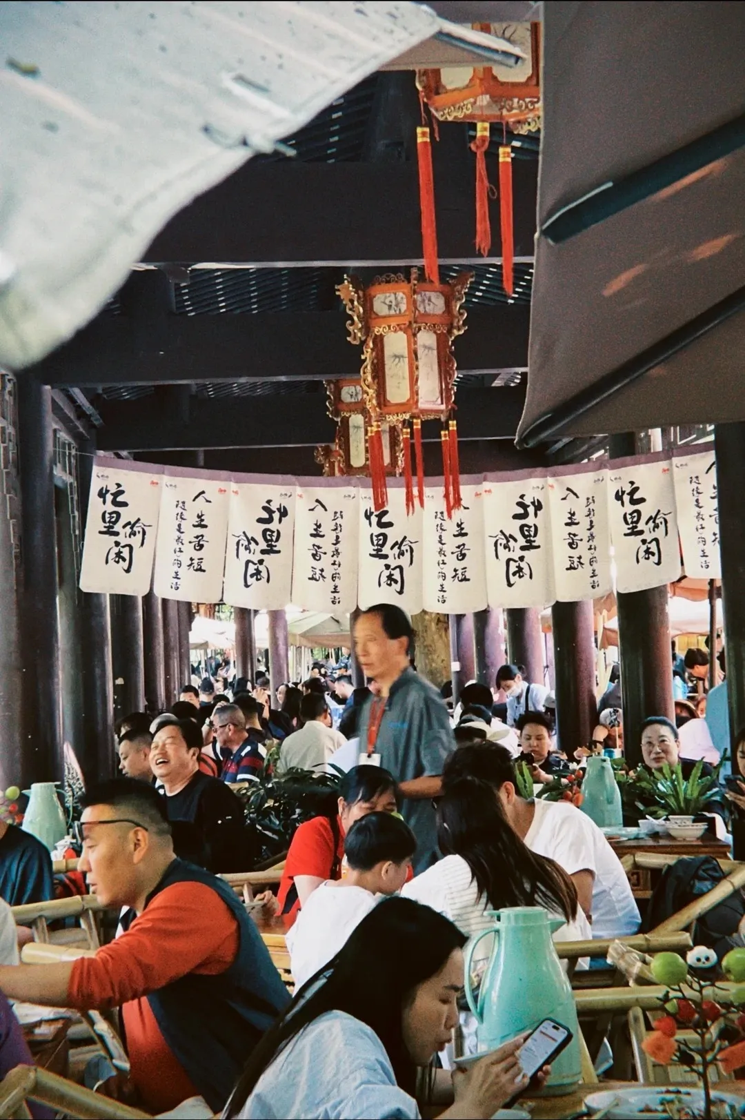 The red-lantern pavilion and bamboo chairs of the Heming Teahouse