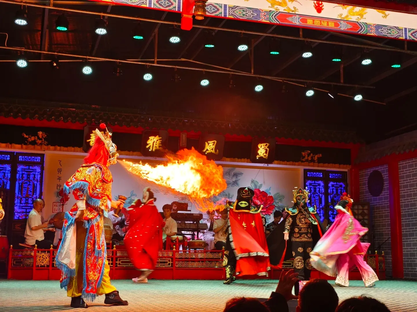 Close-up of a Sichuan Opera performer's painted mask and costume