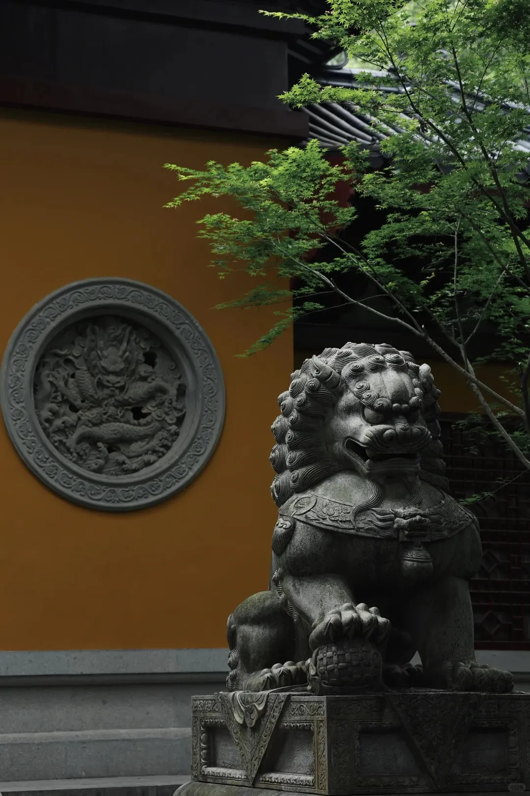 Lingyin Temple tucked into the forested hillside of Feilai Peak