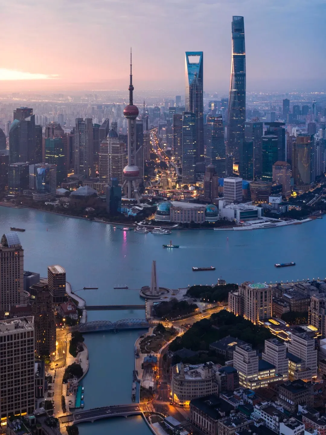 Shanghai skyline and Huangpu River at sunset