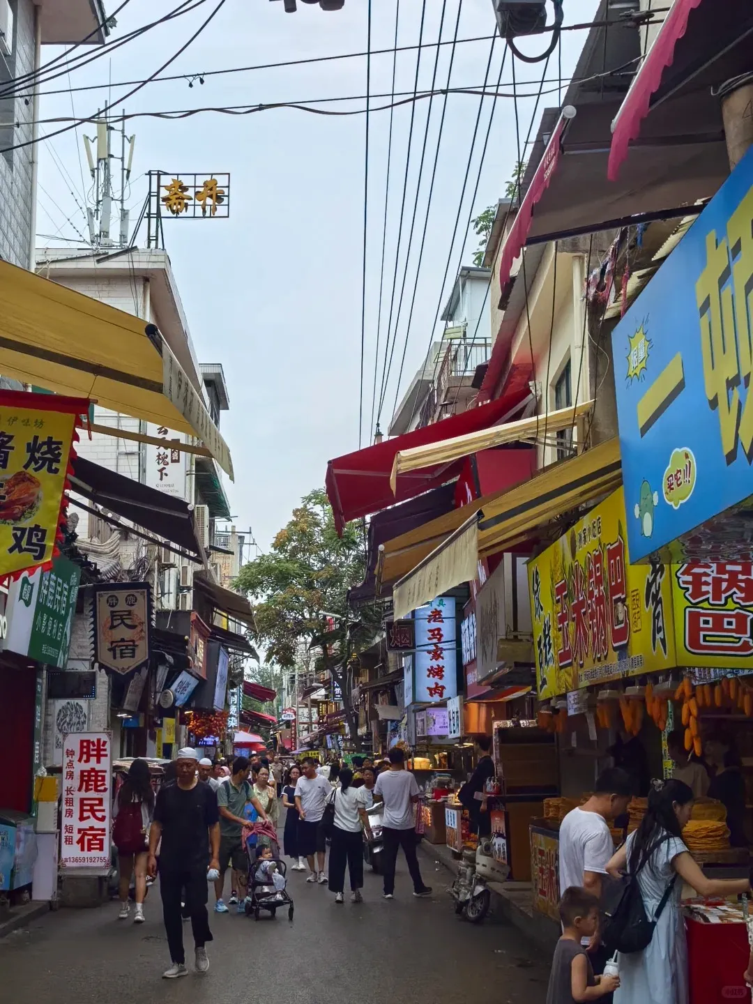 Shared grilled food and dishes at a Xi'an Muslim Quarter restaurant